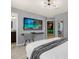 Spacious main bedroom with ensuite bathroom, TV, and access to a game room at 4141 Lana Ave, Davenport, FL 33897