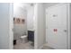 Modern powder room with gray vanity and wood-look floors at 4403 Le Reve Ct, Kissimmee, FL 34746