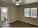 Bright bedroom with wood-look floors and en-suite bathroom at 4423 Reaves Rd, Kissimmee, FL 34746