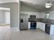 Spacious kitchen with stainless steel appliances and granite countertops at 4423 Reaves Rd, Kissimmee, FL 34746