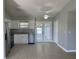 Kitchen with stainless steel appliances and access to the Florida room at 4423 Reaves Rd, Kissimmee, FL 34746
