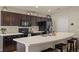 Modern kitchen with dark cabinetry and an expansive island at 4642 Calumet Dr, Saint Cloud, FL 34772