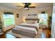 King-size bed, hardwood floors, and neutral decor at 504 Ridge View Dr, Davenport, FL 33837