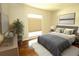 Bedroom featuring hardwood floors, a comfortable bed, and modern decor at 504 Ridge View Dr, Davenport, FL 33837