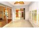 Sunroom with sliding glass doors leading to the backyard and a ceiling fan at 504 Ridge View Dr, Davenport, FL 33837