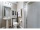 Clean bathroom with walk-in shower, toilet and pedestal sink at 5107 Killarney Way, Kissimmee, FL 34746