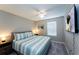 King bedroom with ceiling fan and TV at 5107 Killarney Way, Kissimmee, FL 34746