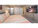 King bedroom with ensuite bathroom access and large TV at 5107 Killarney Way, Kissimmee, FL 34746
