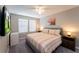 Spacious bedroom with king-size bed and mounted TV at 5107 Killarney Way, Kissimmee, FL 34746
