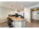 Modern kitchen with granite countertops and stainless steel appliances, breakfast bar at 5107 Killarney Way, Kissimmee, FL 34746