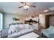Comfortable living room with sectional sofa, TV and ceiling fan, adjacent to kitchen at 5107 Killarney Way, Kissimmee, FL 34746
