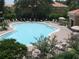 Community pool with surrounding lounge chairs at 5107 Killarney Way, Kissimmee, FL 34746