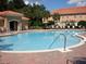 Community pool with lounge chairs at 5107 Killarney Way, Kissimmee, FL 34746