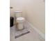 Simple toilet and floor in a small bathroom at 527 Noble Ave, Davenport, FL 33837