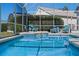 Relaxing screened pool area with lounge chairs at 543 Birkdale St, Davenport, FL 33897