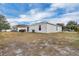 Spacious backyard with a view of neighboring houses at 608 Gila Dr, Kissimmee, FL 34759
