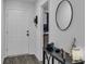 Bright entryway with wood-look floors and a black console table at 608 Gila Dr, Kissimmee, FL 34759