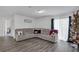 Living room with sectional sofa and a Christmas tree at 608 Gila Dr, Kissimmee, FL 34759
