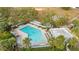 Aerial view of community pool with lounge chairs at 7710 Indian Ridge S Trl, Kissimmee, FL 34747