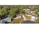 Aerial view of a house with a pool, showcasing its location in a residential neighborhood at 8438 Bay Oak Ct, Orlando, FL 32810