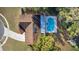 An aerial view of a house featuring a kidney-shaped pool in the backyard at 8438 Bay Oak Ct, Orlando, FL 32810