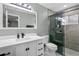 Bathroom with white cabinets and a frameless shower at 8438 Bay Oak Ct, Orlando, FL 32810