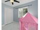 bedroom with a pink play tent and closet at 8438 Bay Oak Ct, Orlando, FL 32810