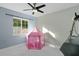 Charming bedroom with a play tent and large window at 8438 Bay Oak Ct, Orlando, FL 32810