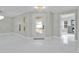 Bright and spacious entryway with marble flooring and modern interior doors at 8438 Bay Oak Ct, Orlando, FL 32810