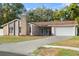 Charming one-story house with stone accents and a two-car garage at 8438 Bay Oak Ct, Orlando, FL 32810