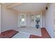 Inviting front porch with updated flooring and a glass front door at 8438 Bay Oak Ct, Orlando, FL 32810