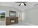 Living room featuring a modern fireplace and light color palette at 8438 Bay Oak Ct, Orlando, FL 32810