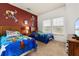 Toy Story themed bedroom with twin beds, nightstands, and TV at 8984 Silver Pl, Kissimmee, FL 34747