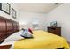 King-size bedroom with yellow bedding, TV, and wood furniture at 8984 Silver Pl, Kissimmee, FL 34747