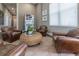 Relaxing community lounge with leather seating and a wicker coffee table at 8984 Silver Pl, Kissimmee, FL 34747