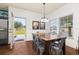 Bright dining room with a wood table and gray chairs at 8984 Silver Pl, Kissimmee, FL 34747