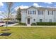 Two-story light green townhome with landscaping and parking at 8984 Silver Pl, Kissimmee, FL 34747