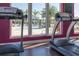 Modern fitness center with treadmills and pool view at 8984 Silver Pl, Kissimmee, FL 34747