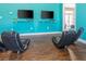 Game room with comfortable seating and large screen TVs for gaming at 8984 Silver Pl, Kissimmee, FL 34747
