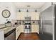 Modern kitchen with stainless steel appliances and granite countertops at 8984 Silver Pl, Kissimmee, FL 34747