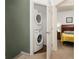 Convenient laundry closet with stackable washer and dryer at 8984 Silver Pl, Kissimmee, FL 34747