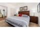 Main bedroom with king-size bed and an ensuite bathroom at 8984 Silver Pl, Kissimmee, FL 34747