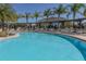 Resort-style swimming pool with lounge chairs at 8984 Silver Pl, Kissimmee, FL 34747