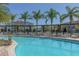 Large community pool with surrounding lounge chairs at 8984 Silver Pl, Kissimmee, FL 34747