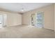 Spacious living room with neutral color palette and carpet at 9650 Bay Pine Ln, Orlando, FL 32832