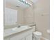 Clean bathroom with single sink vanity and toilet at 1020 Golf Course Pkwy, Davenport, FL 33837