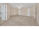 Spacious bedroom with carpet and multiple doors at 1020 Golf Course Pkwy, Davenport, FL 33837