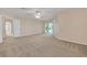 Large bedroom with carpeted floor and sliding doors at 1020 Golf Course Pkwy, Davenport, FL 33837