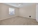 Bright bedroom with carpeted floors and a large window at 1020 Golf Course Pkwy, Davenport, FL 33837