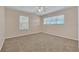Spacious bedroom with neutral carpeting and ceiling fan at 1020 Golf Course Pkwy, Davenport, FL 33837
